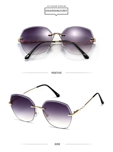 Detail view of gold metal sunglasses with wavy temples and gradient purple lenses