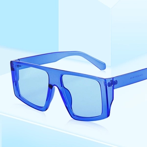 Fashionable square frame oversized sunglasses in translucent royal blue with wide temples