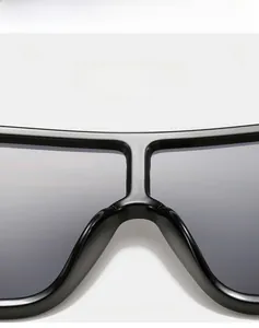 Close-up of black oversized sunglasses showing lightweight material and super elastic frame