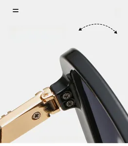 Close-up of durable golden metal hinge on black oversized sunglasses frame with screws
