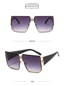 Detail of oversized square sunglasses with a metallic H-logo on the bridge and thick temples