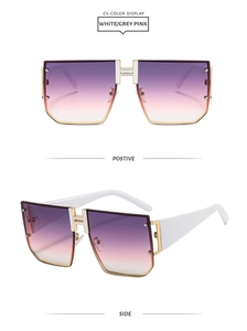 Detail view of square sunglasses with a gold H bridge and pink gradient lenses