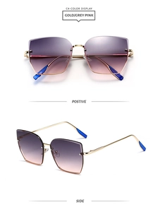 Détail de lunettes de soleil sans monture surdimensionnées irrégulières avec branches dorées