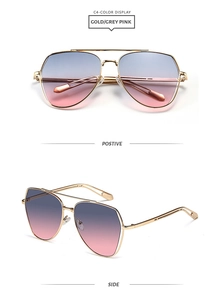 Detail view of double bridge aviator sunglasses with gold metal frame and gradient lenses
