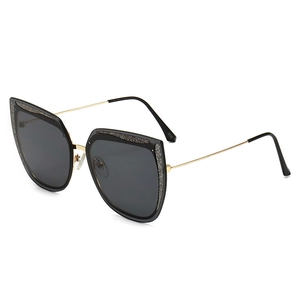 Occhiali da sole cat eye alla moda con aste in metallo dorato e glitter
