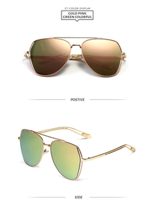 Detail of pilot sunglasses with gold double bridge metal frame and colorful mirror lenses