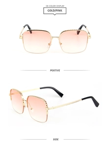 Macro detail of gold metal sunglasses with pink gradient lenses and textured frames