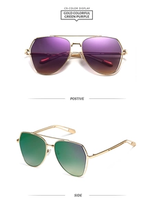 Detailed front and side views of oversized gold metal sunglasses with gradient lenses