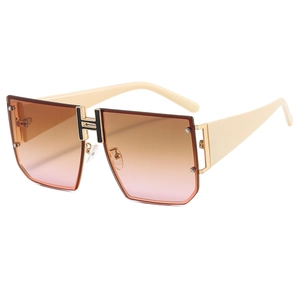 Oversized square sunglasses with gradient lenses and a golden H-shaped bridge detail