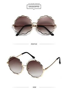 Détail de lunettes de soleil en métal doré festonné avec verres dégradés, vues de face et de profil