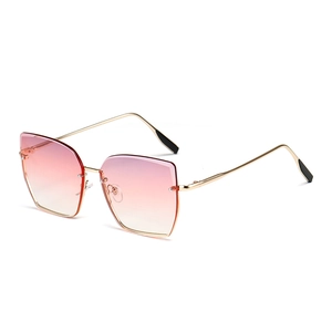Lunettes de soleil œil de chat sans monture avec verres dégradés roses et monture en métal doré