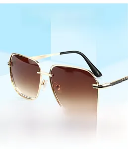 Detailed macro view of gradient brown lenses and golden metal textured frame sunglasses