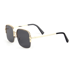 Fashionable oversized square sunglasses with gold textured metal frame and dark lenses