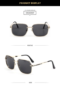Detail view of gold metal square sunglasses with grey lenses and slim hollowed temples