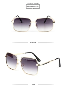 Detail of square gold metal sunglasses with double grey gradient lenses and hollow frames