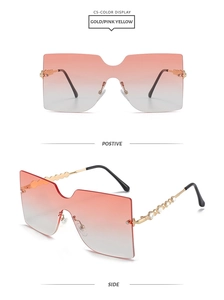Detail of rimless sunglasses with gradient lenses and rhinestone studded gold temples