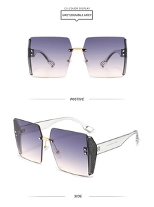 Detail of square rimless sunglasses with gradient lenses and glitter temple accents