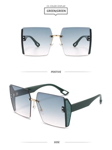 Detail of square rimless gradient sunglasses with gold bridge and glitter green temples