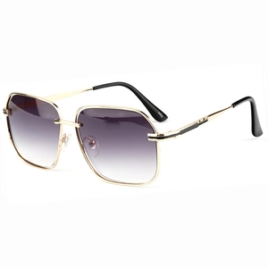 Oversized gold metal frame sunglasses with purple gradient lenses for a stylish look