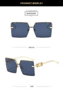 Detail view showing black gradient lenses and gold metal frames of square sunglasses