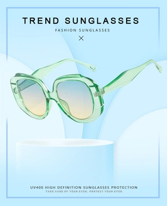 Detail of light green diamond frame sunglasses with UV400 gradient lenses and modern design