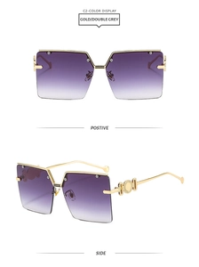 Detail of gold metal temples with circular embossed texture on gradient square sunglasses
