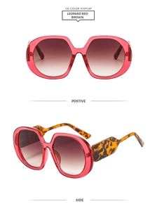 Detail view of leopard red brown oversized sunglasses with stylish gradient lenses