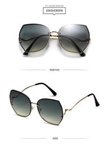 Detail of gold metal geometric sunglasses with green gradient lenses and curved temples