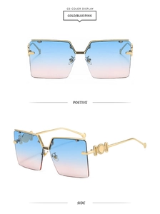 Detail of gold metal frame sunglasses featuring blue-pink gradient lenses and side relief