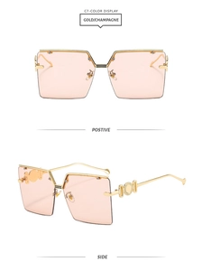 Detail view of gold metal hinges and champagne gradient lenses on rimless sunglasses