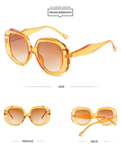 Multi-angle views of orange diamond sunglasses with gradient lenses and cut-out details