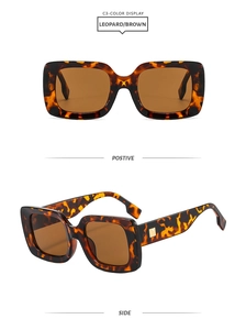 Detail view of square leopard print sunglasses with brown lenses and gold hardware