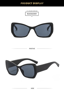 Détails macro des lunettes de soleil œil-de-chat noires avec verres gris et monture polie