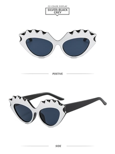 Front and side views of silver wavy cat-eye sunglasses with dark grey UV lenses