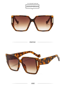 Detail view of leopard print geometric sunglasses with brown gradient lenses