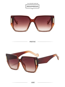 Detail view of brown gradient lenses and stylish square frame sunglasses
