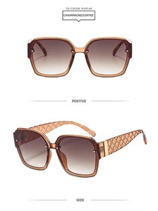 Detail view of champagne square sunglasses with gradient lenses and textured temples