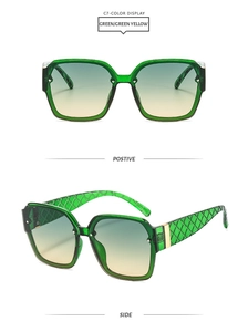 Detail view of transparent green sunglasses with diamond-textured temples and gradient lenses