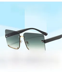 Close-up of semi-rimless square sunglasses featuring gradient lenses and gold rivet details