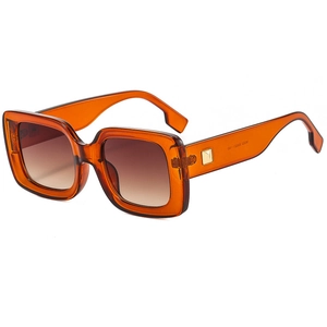 Retro square sunglasses with amber orange frames and gradient brown lenses