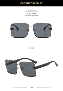 Detail view of half-frame square sunglasses with silver studs and gold metal bridge