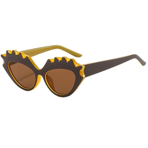 Retro cat-eye sunglasses with wavy jagged yellow and black frame and brown lenses