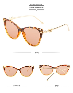 Detailed view of cat eye leopard sunglasses with golden butterfly metal temples
