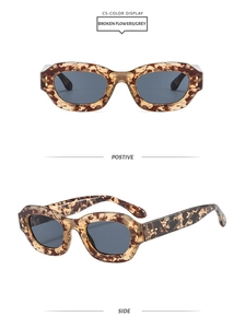 Detail view of leopard print oval sunglasses with gray lenses and retro floral frame