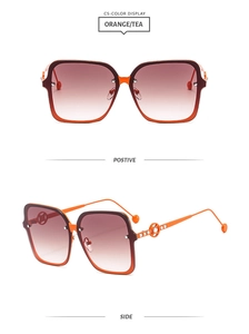 Detail of square orange sunglasses featuring diamond-encrusted hollow ring temples