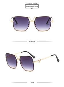 Detail of square gold metal sunglasses featuring V-shaped rhinestone embellishments
