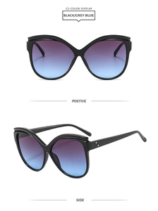 Vue détaillée de lunettes papillon œil-de-chat avec verres dégradés violets et accents en métal