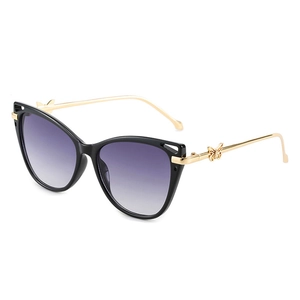 Cat eye sunglasses for women with purple gradient lenses and golden butterfly metal temples