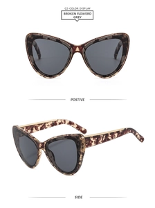 Vue détaillée de face et de côté des lunettes de soleil œil de chat motif léopard
