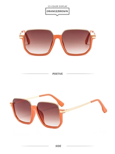 Detail of square orange frames with brown gradient lenses and slim gold metal temples